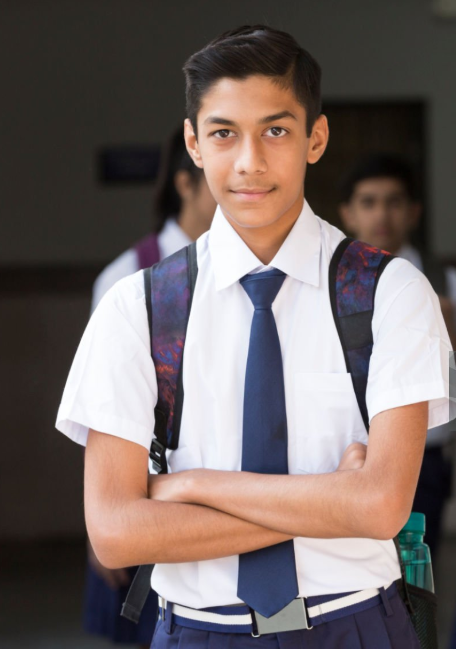 Complete school uniform set including white shirt, navy trousers and tie, manufactured in cotton blend fabric by Divine Uniform for schools across Delhi NCR